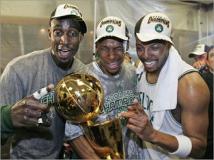 Garnett and Pierce, pictured with Ray Allen and Larry O'Brien Trophy in 2008. (Source: AP Photo)