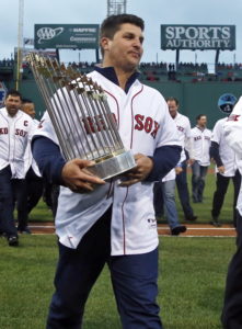 Keith Foulke cradling the world series trophy