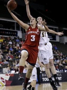 Bethany Doolittle defends against the Cornhuskers Hailie Sample (Photo Credit: Nam Y. Huh, AP).