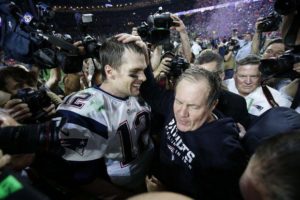 Tom Brady and Bill Belichick embrace after winning the Super Bowl
