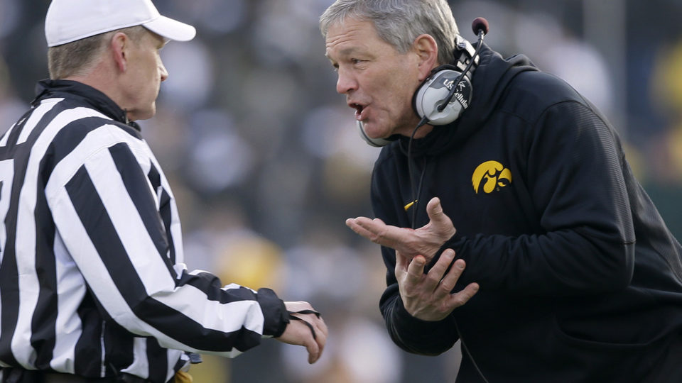 Kirk Ferentz arguing with a referee